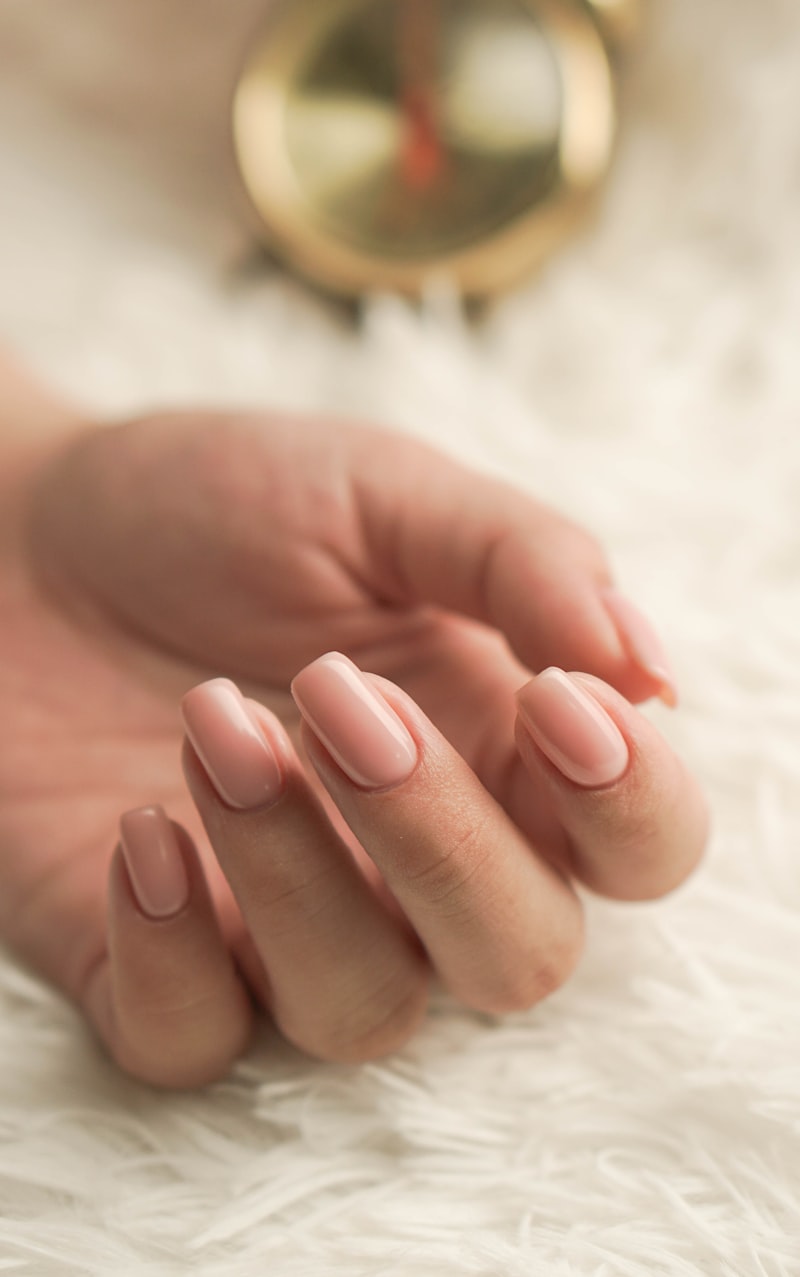 Close up of a soft blush manicure